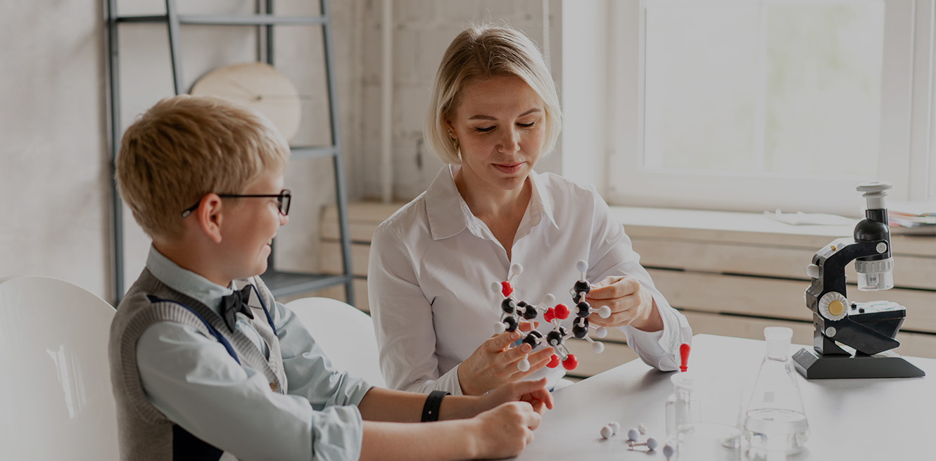 Female science tutor in Temecula studying chemistry with student