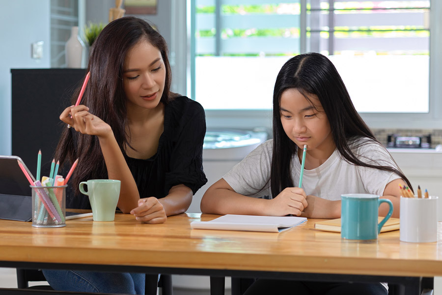 student and tutor together at a desk in Temecula